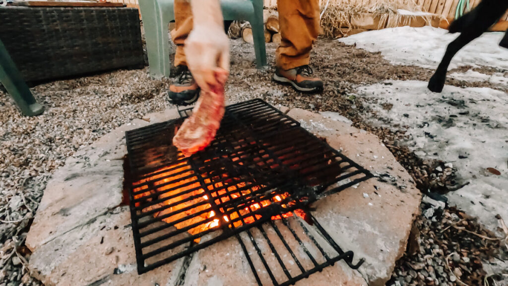 Beneath the Maple grilling-steaks-over-campfire-1024x576 5 Unique Meals to Cook Outside in Your Denver Backyard this Summer  